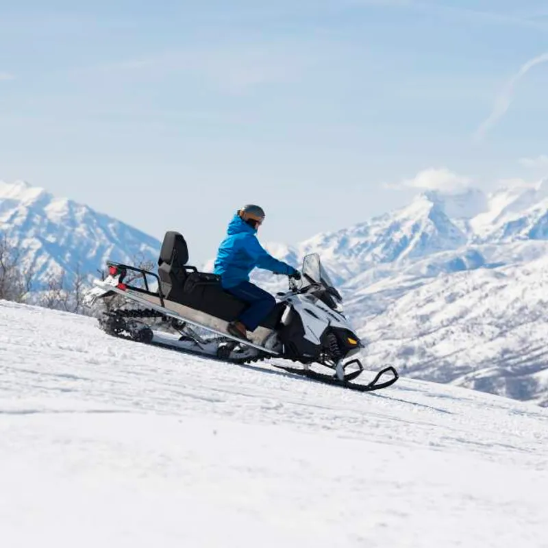 Snowmobile on Ridge with Timpanogos in the background